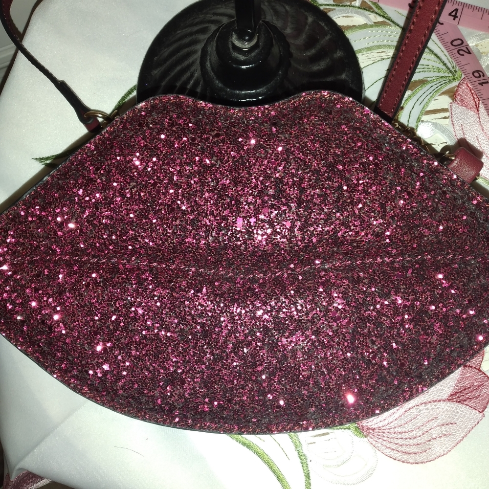 Aldo pink sparkle lips handbag.